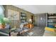 Cozy room featuring vintage wood walls, neutral flooring, and a functional layout for work and relaxation at 4015 52Nd Street W Ct, Bradenton, FL 34209