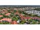 Panoramic aerial view of a residential community featuring a pond, mature trees and green spaces at 4138 Central Sarasota Pkwy # 1524, Sarasota, FL 34238