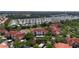 Beautiful aerial view of a residential community with mature trees, a pond and manicured landscaping at 4138 Central Sarasota Pkwy # 1524, Sarasota, FL 34238