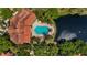 An aerial of a home with a beautiful pool and lush landscaping at 4138 Central Sarasota Pkwy # 1524, Sarasota, FL 34238