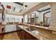 Lobby bar with a sink, granite countertops, travertine stone accents and seating at 4138 Central Sarasota Pkwy # 1524, Sarasota, FL 34238