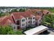 Charming multi-story building with tile roof and well-maintained landscaping at 4138 Central Sarasota Pkwy # 1524, Sarasota, FL 34238