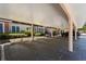 A covered carport with designated parking spaces protects vehicles from the elements at 4138 Central Sarasota Pkwy # 1524, Sarasota, FL 34238