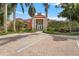 The welcoming clubhouse features elegant architecture and lush landscaping at 4138 Central Sarasota Pkwy # 1524, Sarasota, FL 34238