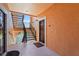Exterior view of the building, showcasing the entry door and stairwell at 4138 Central Sarasota Pkwy # 1524, Sarasota, FL 34238