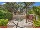 View of community hot tub covered by pergola with privacy landscaping at 4138 Central Sarasota Pkwy # 1524, Sarasota, FL 34238