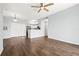 Open concept layout featuring hardwood floors and a seamless transition to the kitchen at 4138 Central Sarasota Pkwy # 1524, Sarasota, FL 34238