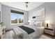 Comfortable bedroom with a neutral palette, large window, and hardwood floors at 4138 Central Sarasota Pkwy # 1524, Sarasota, FL 34238