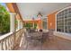 Covered patio with decorative pillars and outdoor furniture at 4138 Central Sarasota Pkwy # 1524, Sarasota, FL 34238