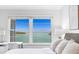 Sunny bedroom featuring water view and comfortable work space by the window at 4310 Falmouth Dr # 305, Longboat Key, FL 34228