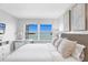 Bright bedroom with large window offers views of the beautiful blue water at 4310 Falmouth Dr # 305, Longboat Key, FL 34228