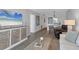 Open floor plan with a living area that showcases modern furnishings and light-colored wood flooring at 4310 Falmouth Dr # 305, Longboat Key, FL 34228