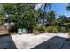 Tranquil backyard featuring a seating area surrounded by lush greenery and beautiful landscaping at 4639 Sloan Ave, Sarasota, FL 34233