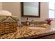 Bathroom vanity features granite countertop, sink and accessories, creating a warm ambiance at 4639 Sloan Ave, Sarasota, FL 34233