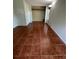 Bedroom with neutral walls, tile floor, and a closet for storage at 4639 Sloan Ave, Sarasota, FL 34233