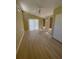 Bedroom with natural light, complemented by light wood floors and warm toned walls at 4639 Sloan Ave, Sarasota, FL 34233