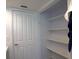 Walk-in closet with multiple shelves for ample storage space at 4639 Sloan Ave, Sarasota, FL 34233