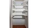 Closet with built-in shelving offering plenty of storage space at 4639 Sloan Ave, Sarasota, FL 34233