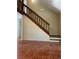 Foyer featuring open staircase with wood railing and tile flooring at 4639 Sloan Ave, Sarasota, FL 34233