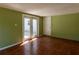 Open-concept living room with tile flooring and double doors to the backyard at 4639 Sloan Ave, Sarasota, FL 34233