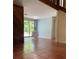 Open-concept living room showcasing tile flooring and a sliding glass door to the backyard at 4639 Sloan Ave, Sarasota, FL 34233