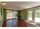 Bright living room with tile flooring, slider to patio, and a view of the yard at 4639 Sloan Ave, Sarasota, FL 34233