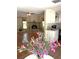 Bright living room featuring tile floors, a fireplace, and an open view to the kitchen at 4639 Sloan Ave, Sarasota, FL 34233