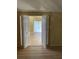 Living room that opens up to a sun-drenched balcony with wood floors at 4639 Sloan Ave, Sarasota, FL 34233