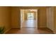Bright living area featuring wood floors with an open doorway to a sunny balcony at 4639 Sloan Ave, Sarasota, FL 34233