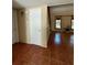 Open-concept living room with tile floors and a staircase, offering ample space at 4639 Sloan Ave, Sarasota, FL 34233