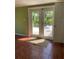 A tiled living room with double doors leading to a beautiful outdoor patio at 4639 Sloan Ave, Sarasota, FL 34233
