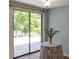 Living room area showcasing a sliding glass door leading to the outdoor patio at 4639 Sloan Ave, Sarasota, FL 34233