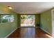 Spacious living room with tile flooring and sliding glass doors to the backyard at 4639 Sloan Ave, Sarasota, FL 34233
