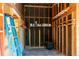 View of a storage room in the home with built-in shelves and a blue ladder at 4639 Sloan Ave, Sarasota, FL 34233