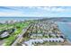 Coastal community aerial view showing golf course, waterways, and beachfront condos at 501 Sloop Ln, Longboat Key, FL 34228