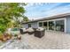 Relax on the back patio with stylish outdoor seating and a view of the sparkling pool at 501 Sloop Ln, Longboat Key, FL 34228