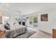Bright bedroom with sliding glass doors leading to a pool area and walk in closet at 501 Sloop Ln, Longboat Key, FL 34228