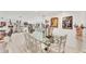 Bright dining room featuring tile floors, a glass dining table and unique artwork at 501 Sloop Ln, Longboat Key, FL 34228