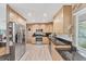 Spacious kitchen with stainless steel appliances and granite countertops at 501 Sloop Ln, Longboat Key, FL 34228