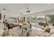 Bright living room with waterfront views, tile floors, and comfortable seating at 501 Sloop Ln, Longboat Key, FL 34228