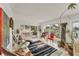 Bright sunroom with large glass doors and views of the outdoor area at 501 Sloop Ln, Longboat Key, FL 34228