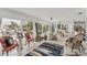 Bright living room featuring tile floors, ample seating, and waterfront views at 501 Sloop Ln, Longboat Key, FL 34228