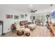 Cozy living room with ample natural light, a modern ceiling fan and comfortable seating at 501 Sloop Ln, Longboat Key, FL 34228