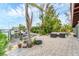 Enjoy outdoor living with a paver patio, waterfront views, and convenient boat dock access at 501 Sloop Ln, Longboat Key, FL 34228