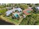 An aerial view of community amenities includes a swimming pool and a tennis court at 5122 Northridge Rd # 112, Sarasota, FL 34238