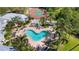 Aerial view of community pool, tennis courts, and manicured landscaping at 5122 Northridge Rd # 112, Sarasota, FL 34238