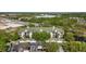 Aerial view of condos with green roofs and surrounded by lush greenery at 5122 Northridge Rd # 112, Sarasota, FL 34238
