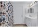 Bright bathroom featuring a modern vanity and updated fixtures at 5122 Northridge Rd # 112, Sarasota, FL 34238