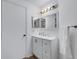 Updated bathroom with modern vanity, ample lighting, and new fixtures at 5122 Northridge Rd # 112, Sarasota, FL 34238