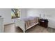 Bedroom featuring neutral paint, natural light, and wood-look flooring at 5122 Northridge Rd # 112, Sarasota, FL 34238